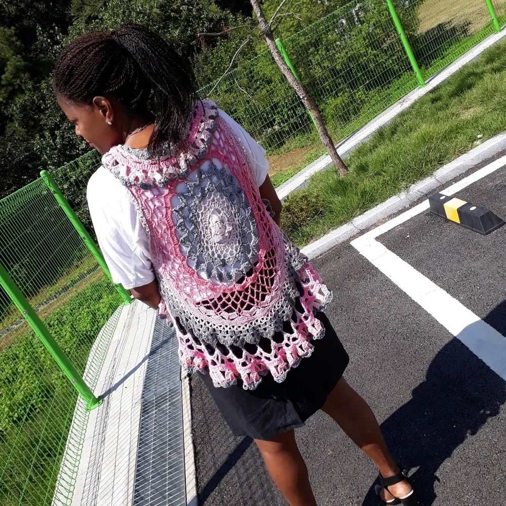 Ruffled crochet vest with intricate mandala design